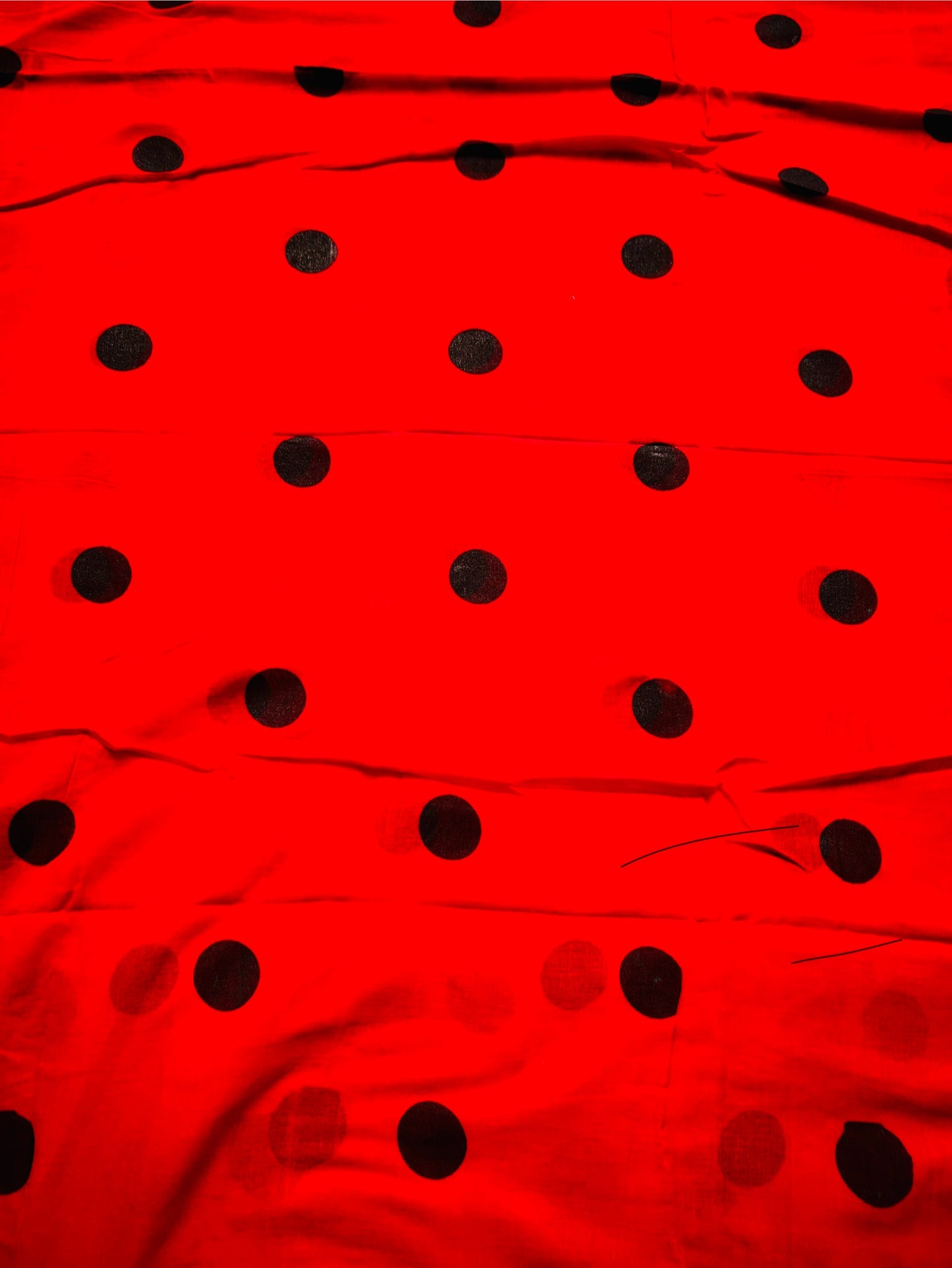 Red mul cotton with black polka dots saree